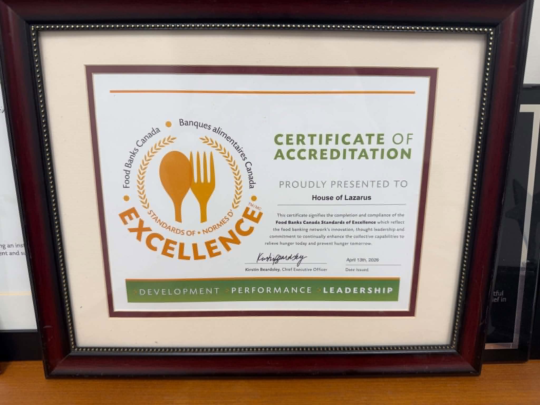 Photo of Certificate of Accreditation from Food Banks Canada to recognize House of Lazarus completing the Standards of Excellence.